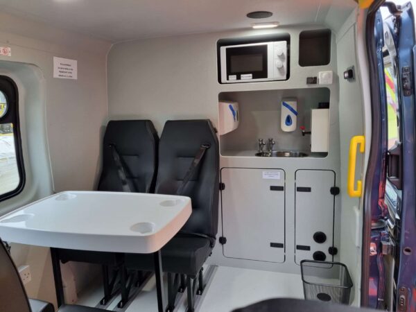 Cooking microwave and kitchen facilities in the rugged welfare van for hire