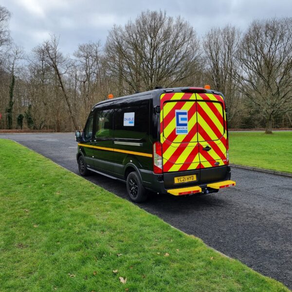 Rear profile featuring high visibility stripes of our rugged large welfare van for hire